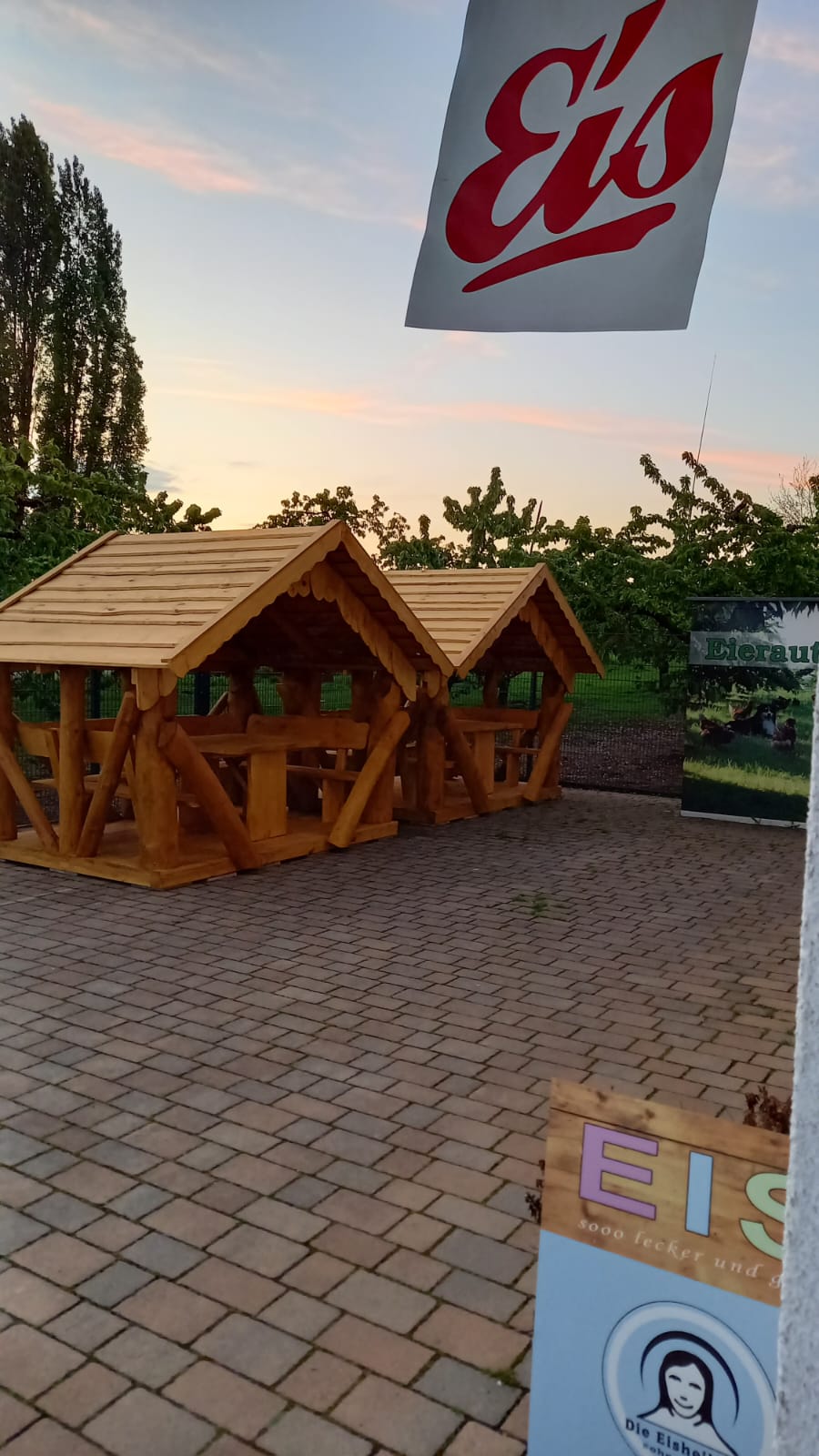 Two matching TimberTeam timber huts in Friedberg